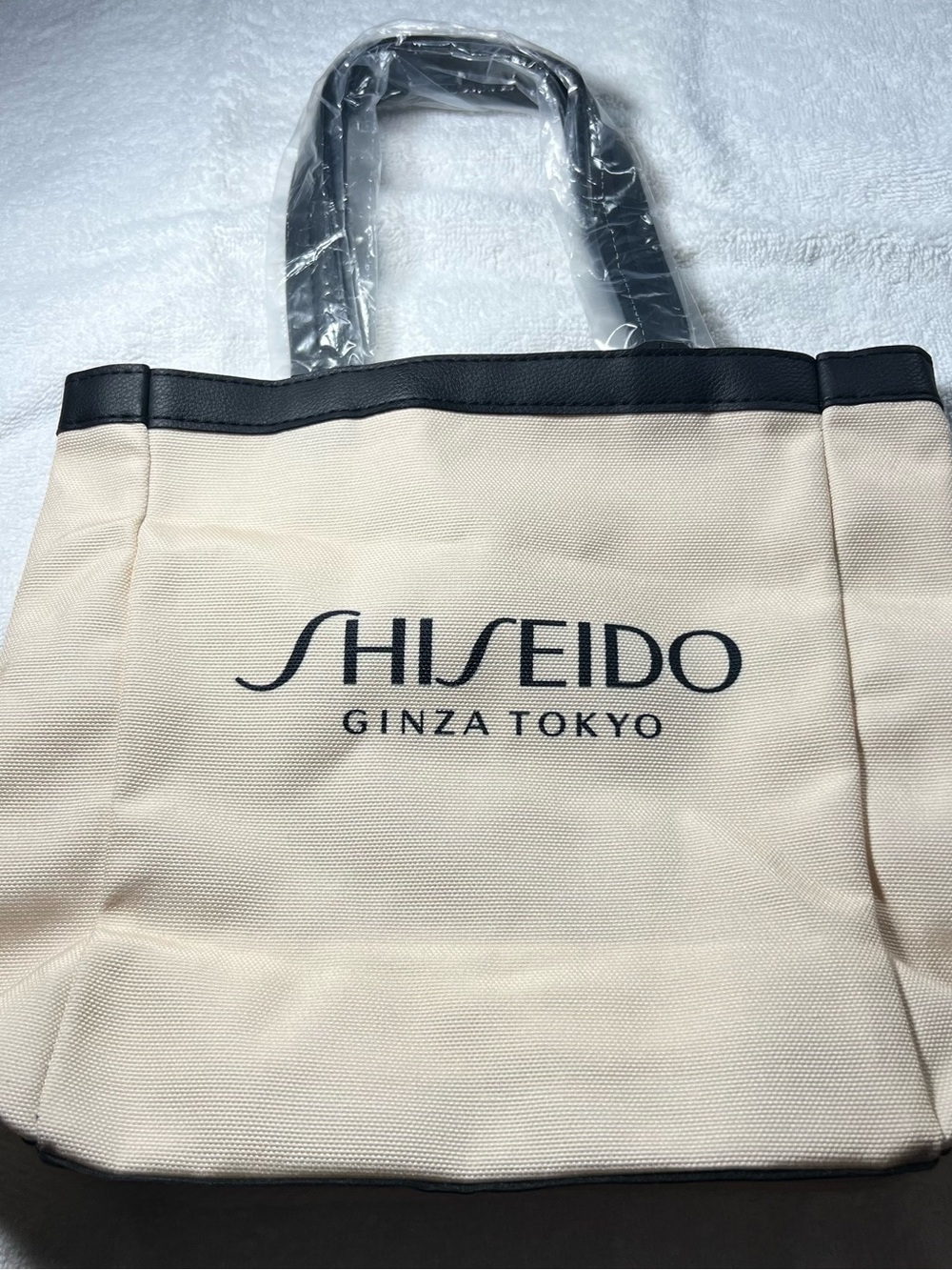 Shiseido Cream Canvas Tote with Black Trim and Logo